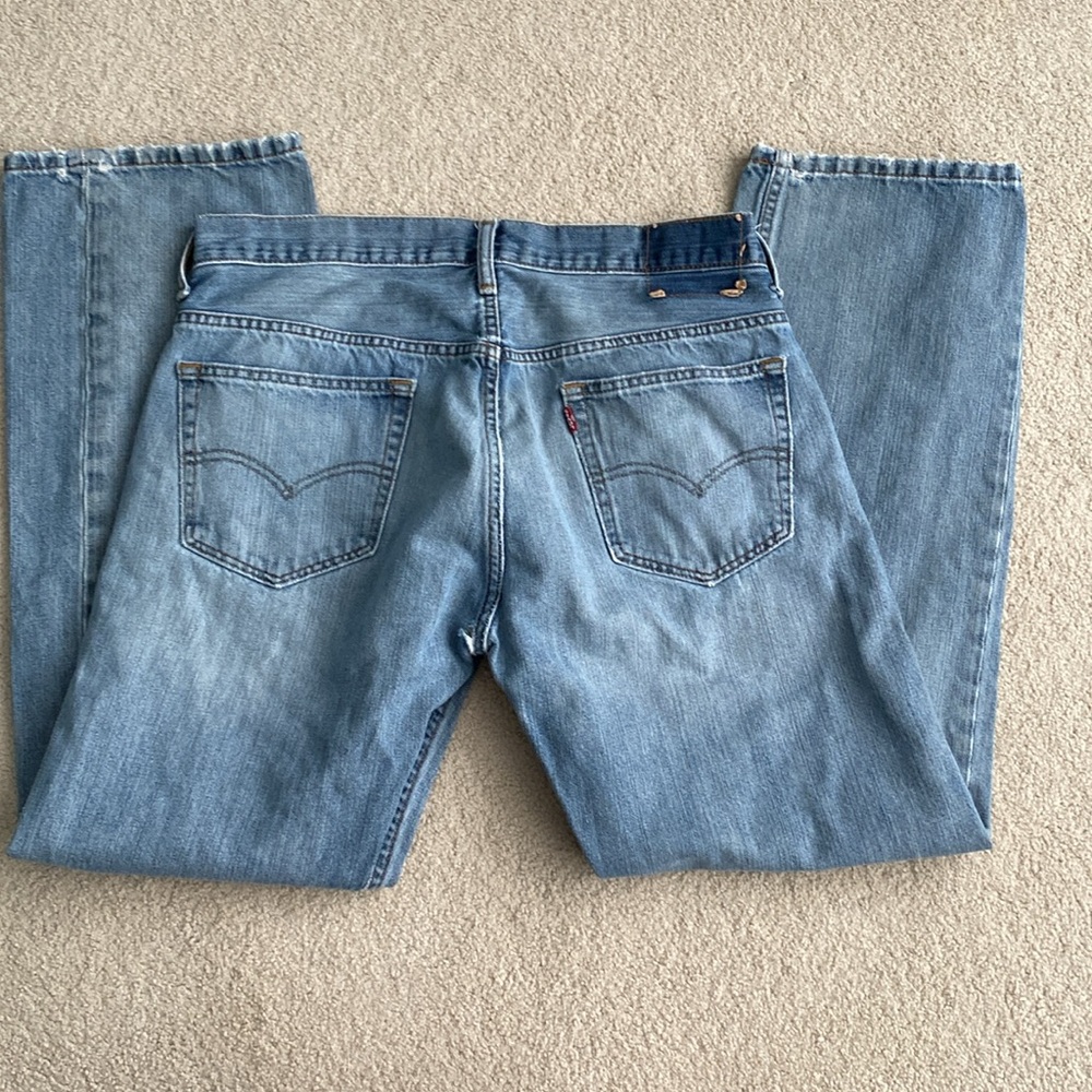 Levi’s 32x32. Well loved with holes.
